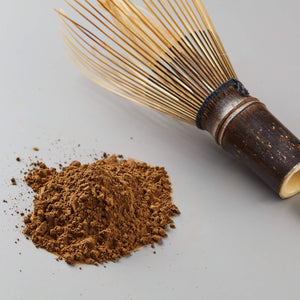 Houji Powder Hugo green tea powder with traditional bamboo whisk for preparing authentic Japanese tea lattes