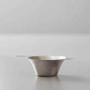 Steel Filter: Elegant stainless steel tea strainer with dual handles for gongfu tea brewing against light gray background