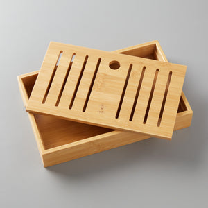 Bamboo tea board with removable slatted top and solid base for catching spills during gongfu tea steeping.