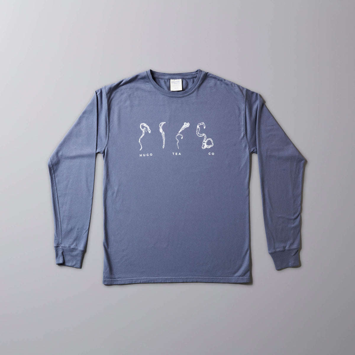 Leaf Sketch long sleeve tee in cornflower blue with white tea leaf designs printed on front