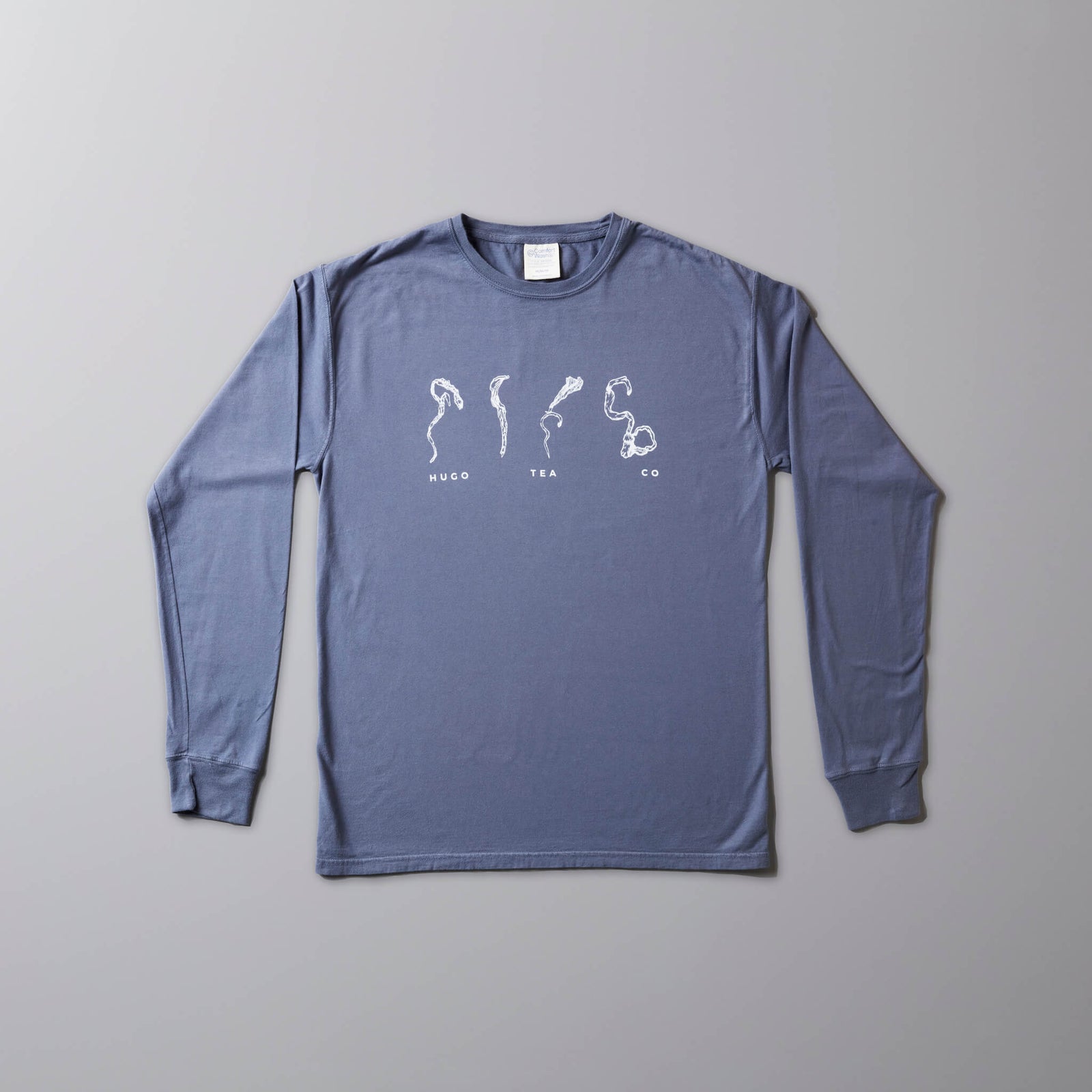 Leaf Sketch long sleeve tee in cornflower blue with white tea leaf designs printed on front
