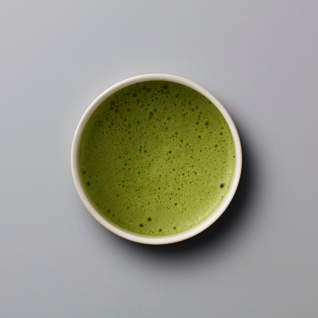 Matcha with a lighter green color, indicating thinness. 