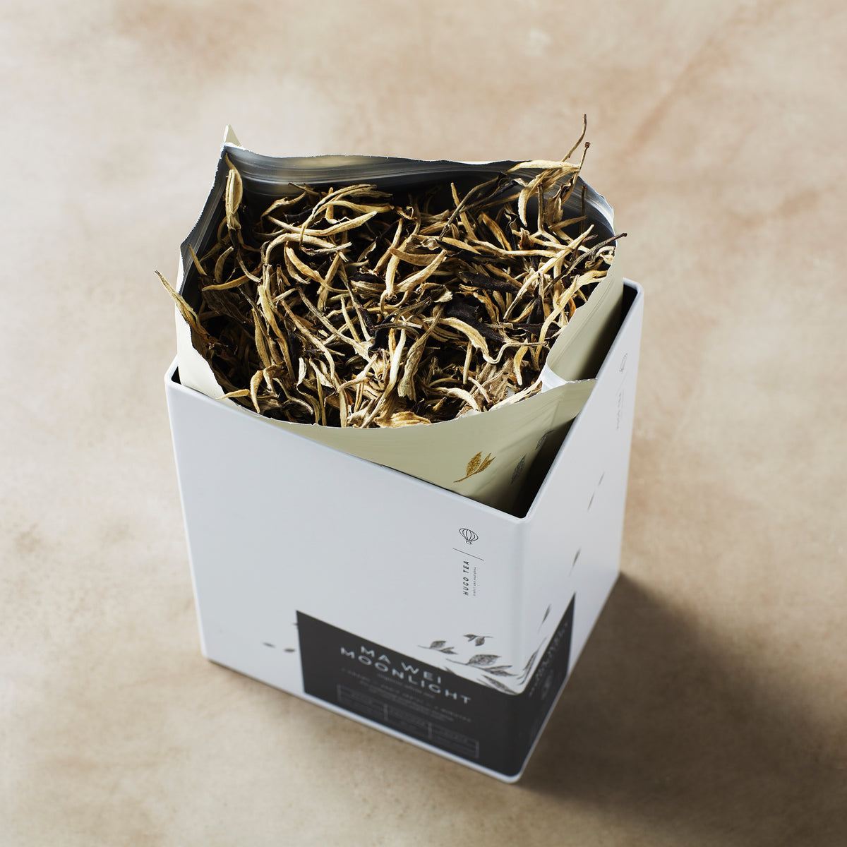 Storage Can MIYABI elegant tea tin with dried loose tea leaves in white packaging box on beige surface